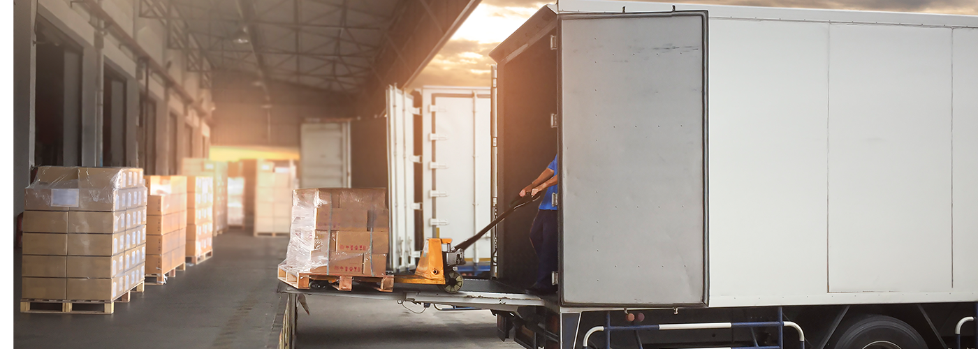 Truck trailer parked at a warehouse for freight loading and distribution